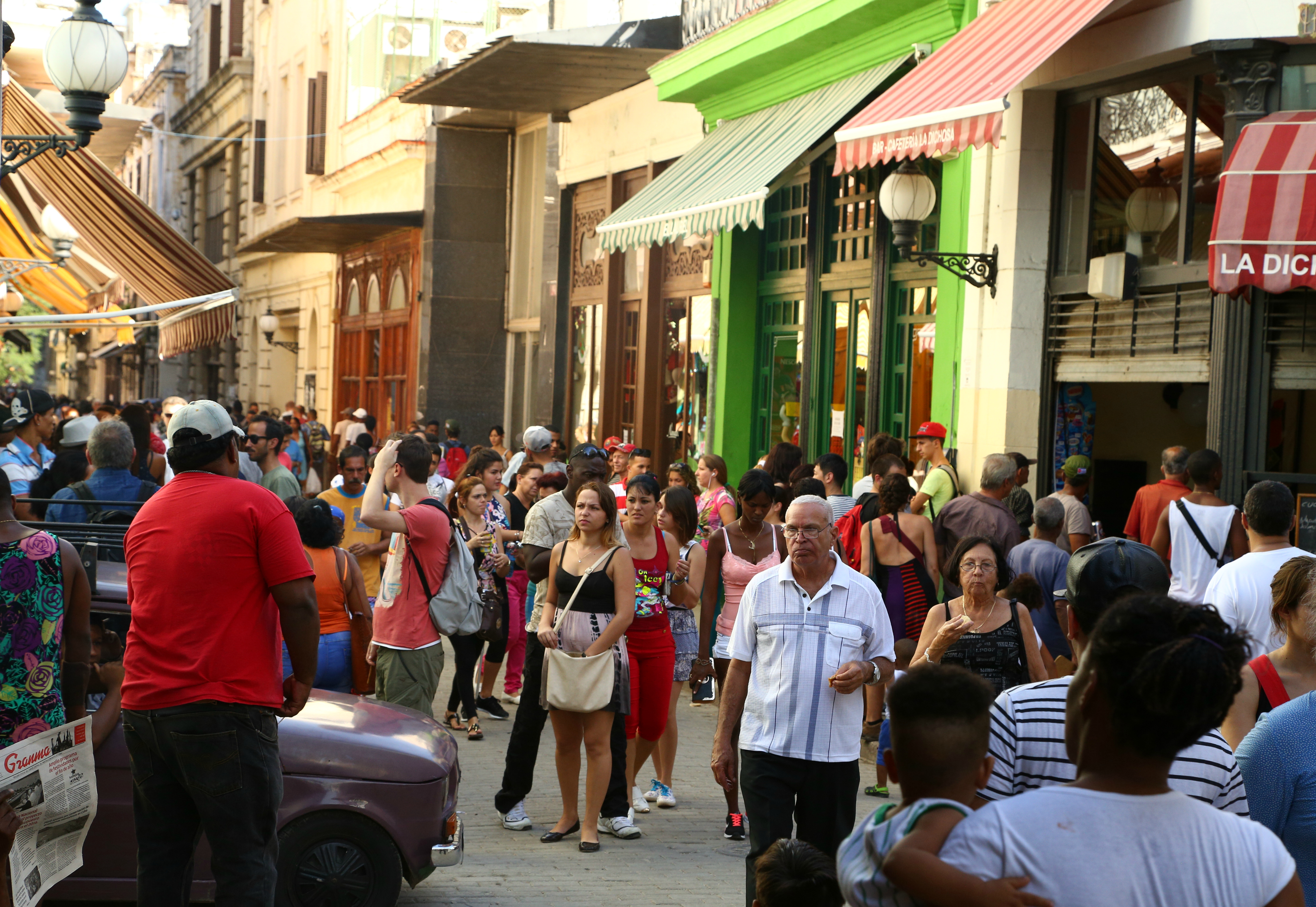 a bustling pedestrian street in Havana
